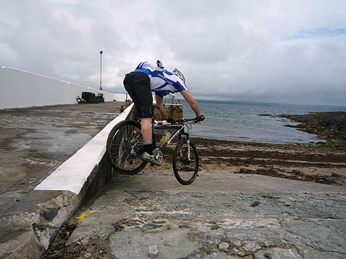 Steve jumps of Portnaguran harbour